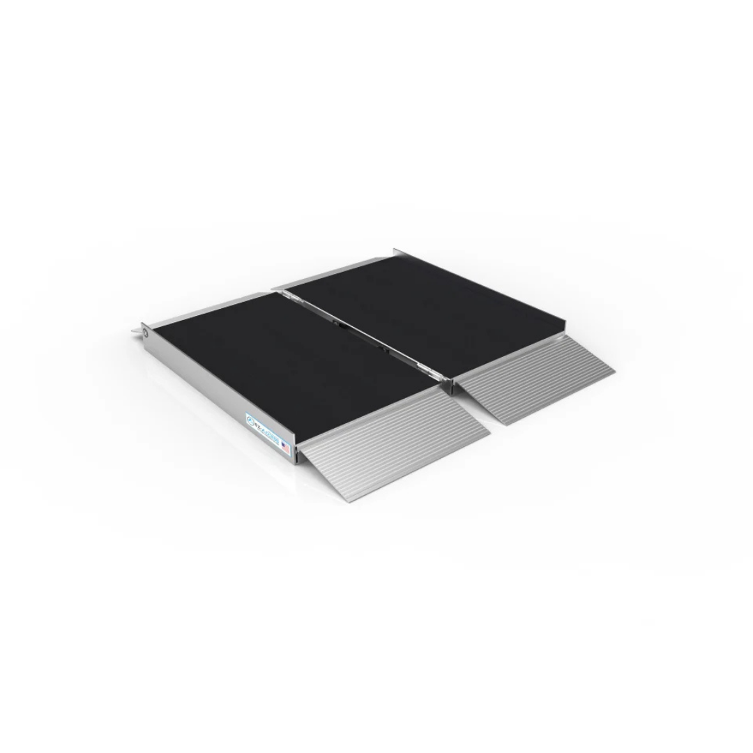 The EZ-Access SUITCASE® Singlefold AS Portable Ramp, with a slip-resistant surface and silver-colored edges plus small entry ramps on both ends, is displayed on a white background.